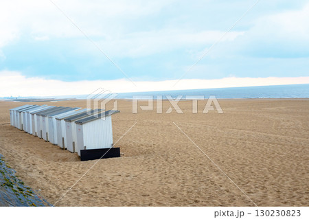 White wood holiday beach cabins on the beach sand. Ostend, Belgium. 130230823