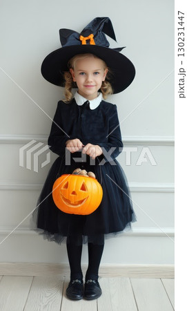 Little girl dressed as a witch for Halloween party Little girl dressed as a witch for Halloween party 130231447