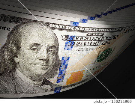Spot Lit Abstract CLose-up Angle of U.S. 100 Dollar Bills Isolated on a Black Background. Spot Lit Abstract CLose-up Angle of U.S. 100 Dollar Bills Isolated on a Black Background. 130231969