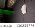 A White Wall Fixture Set Against a Striking Industrial Background Creating a Unique Aesthetic 130235776