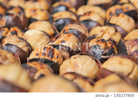 Roasted chestnuts on display at a street market Roasted chestnuts on display at a street market 130237605