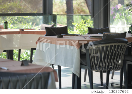 Dining area in a modern restaurant with natural light 130237692