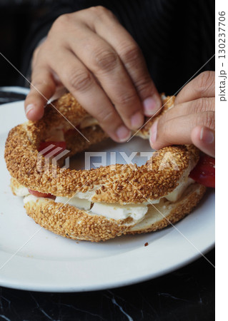 Enjoying a traditional sandwich in a cozy cafe 130237706
