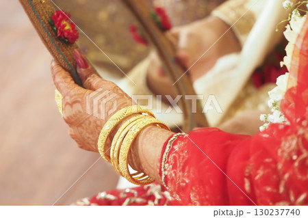 Bridal hands adorned with elegant traditional jewelry 130237740