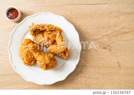 fried chicken with ketchup on plate fried chicken with ketchup on plate 130238787