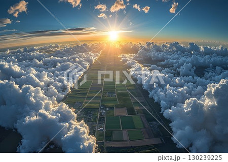 Aerial view of farmland at sunrise, framed by clouds, with a rad 130239225