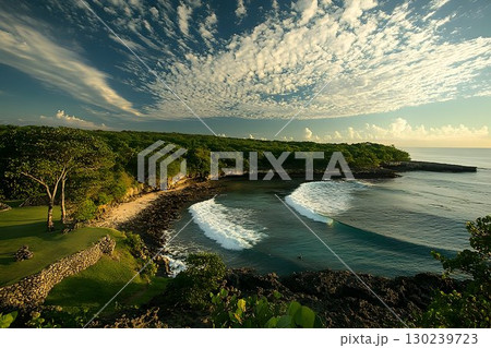 Coastal Serenity: Waves Break on Secluded Beach Under Dramatic S Coastal Serenity: Waves Break on Secluded Beach Under Dramatic S 130239723