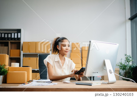 Woman Entrepreneur: SME Business mastering e-commerce with tablet, laptop, packaging, with Online Marketing, Packaging, 130240103