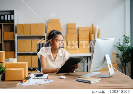 eelance woman working at home office, BOX,tablet and laptop online, marketing, packaging, delivery,  e-commerce concept 130240109