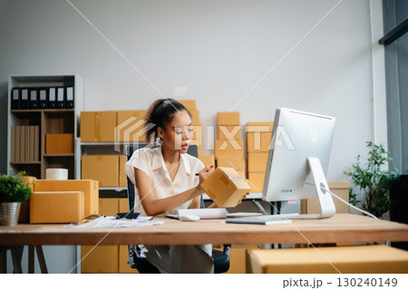 eelance woman working at home office, BOX,tablet and laptop online, marketing, packaging, delivery, e-commerce concept eelance woman working at home office, BOX,tablet and laptop online, marketing, packaging, delivery, e-commerce concept 130240149