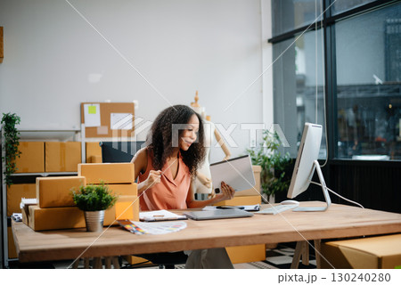 eelance woman working at home office, BOX,tablet and laptop online, marketing, packaging, delivery, e-commerce concept eelance woman working at home office, BOX,tablet and laptop online, marketing, packaging, delivery, e-commerce concept 130240280