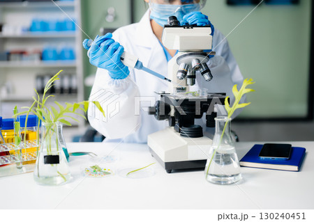 Food science as lab scientists test and analyze vegetables for safety and quality using advanced technology 130240451