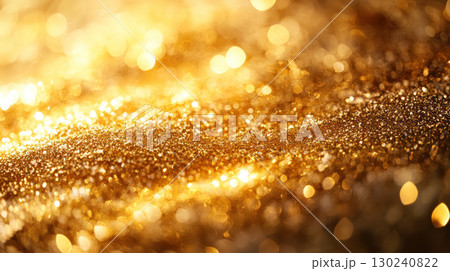 Golden glitter texture with sparkling light reflections creating warm and festive atmosphere in close up view 130240822