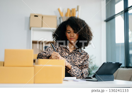 Small business entrepreneur SME freelance woman working at home office, BOX,tablet and laptop online, marketing, packaging Small business entrepreneur SME freelance woman working at home office, BOX,tablet and laptop online, marketing, packaging 130241133