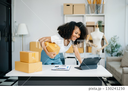 Small business entrepreneur SME freelance woman working at home office, BOX,tablet and laptop online, marketing, packaging Small business entrepreneur SME freelance woman working at home office, BOX,tablet and laptop online, marketing, packaging 130241230
