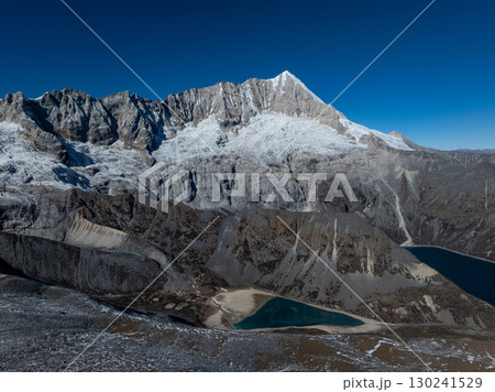 Aerial view of beautiful snow capped mountain and lake landscape in Tibet, China Aerial view of beautiful snow capped mountain and lake landscape in Tibet, China 130241529