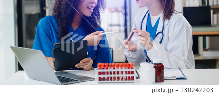Modern Medical Research Laboratory Portrait of Two African American Scientists Working, Using Digital Tablet, Analyzing Samples, Talking. Modern Medical Research Laboratory Portrait of Two African American Scientists Working, Using Digital Tablet, Analyzing Samples, Talking. 130242203