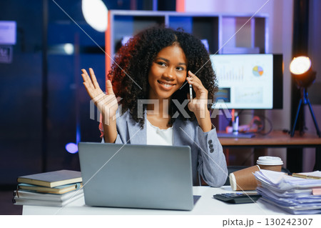 Woman feeling migraine head strain.Overworked businesswoman financier while working on laptop and tablet Woman feeling migraine head strain.Overworked businesswoman financier while working on laptop and tablet 130242307