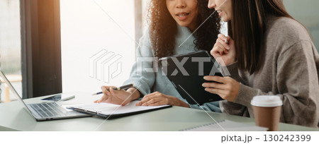 Team work process. Photo young business crew working with new startup project. Project managers meeting. Analyze plans, papers. 130242399