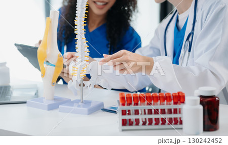 Modern Medical Research Laboratory Portrait of Two African American Scientists Working, Using Digital Tablet, Analyzing Samples, Talking. Modern Medical Research Laboratory Portrait of Two African American Scientists Working, Using Digital Tablet, Analyzing Samples, Talking. 130242452