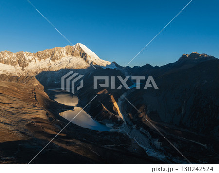 Aerial view of beautiful snow capped mountain and lake sunrise landscape in Tibet, China 130242524