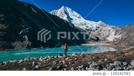 Backpacking woman hiking on high altitude mountains 130242561