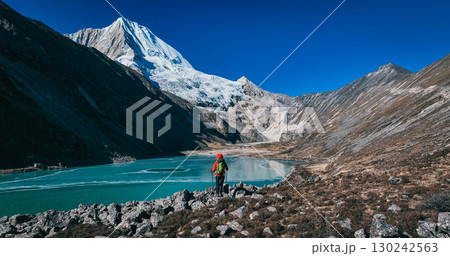 Backpacking woman hiking on high altitude mountains Backpacking woman hiking on high altitude mountains 130242563