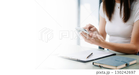 Businesswoman using mobile phone, tablet.Closeup on blurred background Businesswoman using mobile phone, tablet.Closeup on blurred background 130242697