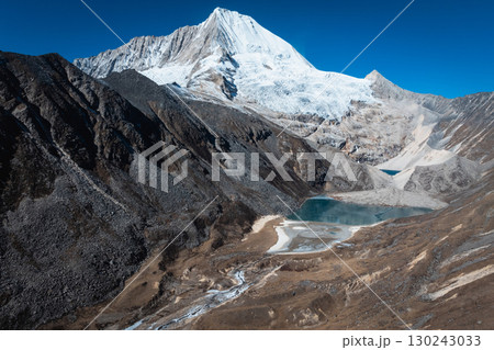 Aerial view of beautiful snow capped mountain and lake landscape in Tibet, China Aerial view of beautiful snow capped mountain and lake landscape in Tibet, China 130243033