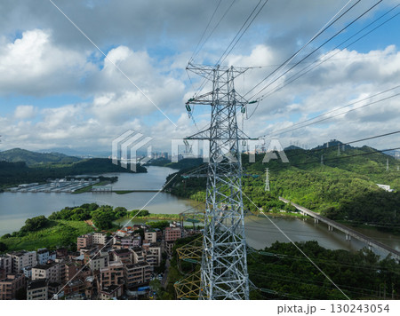 Aerial view of high voltage electricity tower on mountain 130243054