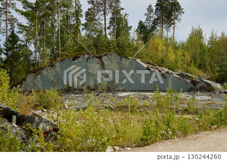 Stunning Scenic Rock Formation Set Within a Lush Verdant Forest Landscape in Natures Embrace Stunning Scenic Rock Formation Set Within a Lush Verdant Forest Landscape in Natures Embrace 130244260