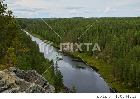 A Stunning River Landscape Beautifully Surrounded by Lush Green Forests and Tranquil Surroundings A Stunning River Landscape Beautifully Surrounded by Lush Green Forests and Tranquil Surroundings 130244313
