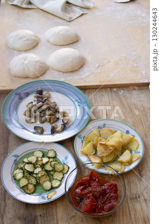 homemade pizza ingredients ready for baking 130244643