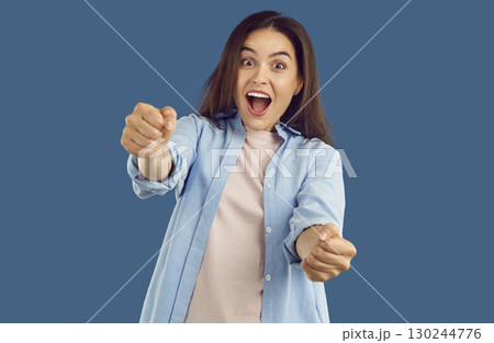 Portrait of funny happy joyful excited young woman driver steering invisible car 130244776