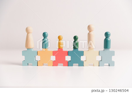 Concept of diversity, inclusion, equality is highlighted in team setup, wooden elements, symbolizing leadership, authority, influence, strong communication skills, inclusive organizational structure. Concept of diversity, inclusion, equality is highlighted in team setup, wooden elements, symbolizing leadership, authority, influence, strong communication skills, inclusive organizational structure. 130246504