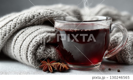 Warm mulled wine with spices and cozy blanket creating winter comfort Warm mulled wine with spices and cozy blanket creating winter comfort 130246565
