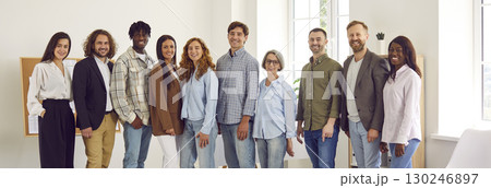 Group portrait of diverse, positive and modern business team posing in office. Group portrait of diverse, positive and modern business team posing in office. 130246897