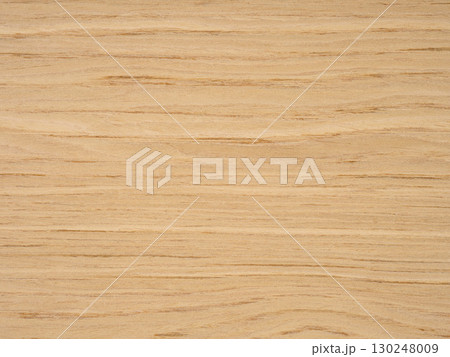 Slavony oak veneer surface with waves of honeyed grain flowing across a smooth canvas 130248009