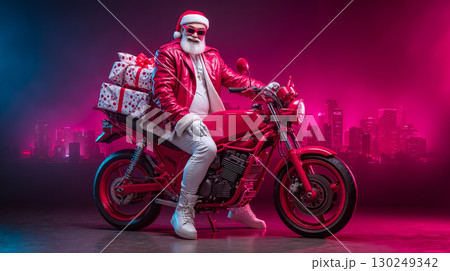 A man dressed as Santa Claus sitting on a red motorcycle with presents 130249342