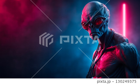 A man with red eyes standing in front of a red light 130249375