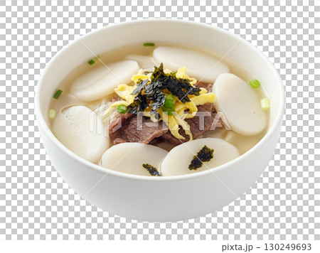 Traditional Korean Rice Cake Soup with Beef and Egg Garnish in White Bowl 130249693