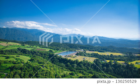 日本の富山県東部の黒部市の丘陵部から見える牧場やため池や富山湾や水田の様子 130250529