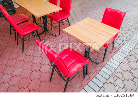 tables and red chairs in outdoor outdoor cafe tables and red chairs in outdoor outdoor cafe 130251364