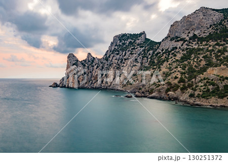rocky sea coast in evening, long exposure rocky sea coast in evening, long exposure 130251372