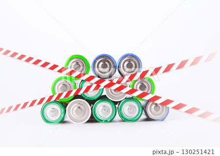 Battery. A lot of batteries on the background of the flag of the country. 130251421