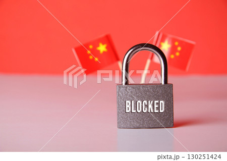 Closed padlock with the inscription lock on the background of the Chinese flag. Closed padlock with the inscription lock on the background of the Chinese flag. 130251424