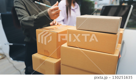 Portrait of Starting small businesses SME owners, two Asian woman check online orders Selling products working with boxs freelance work at home office, sme business online small medium enterprise 130251635