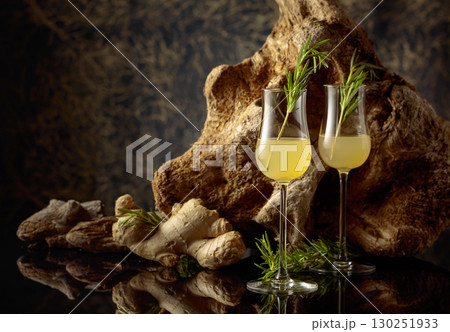 Ginger liquor with a rosemary branch. Ginger liquor with a rosemary branch. 130251933