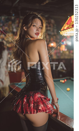 Model poses confidently in a bar setting wearing a stylish outfit with plaid details and a corset during an evening event Model poses confidently in a bar setting wearing a stylish outfit with plaid details and a corset during an evening event 130252313