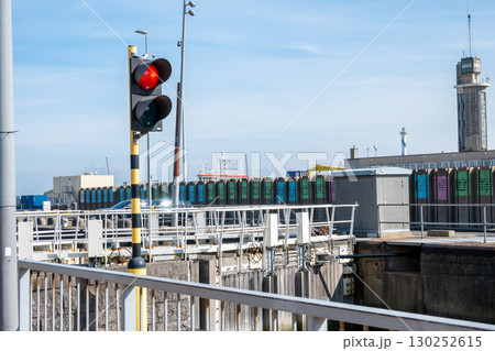 A traffic light in seaport in Ostend, Belgien. Red light signal for boats and ships. A traffic light in seaport in Ostend, Belgien. Red light signal for boats and ships. 130252615
